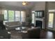 Inviting living room with a fireplace, lots of natural light, ceiling fan, and hardwood flooring at 338 Apalachia Lake Dr, Fuquay Varina, NC 27526