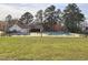 Community pool featuring ample seating, clubhouse, fenced perimeter and a well manicured lawn at 3421 E E Jameson Rd, Raleigh, NC 27604