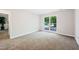 Inviting bedroom with neutral carpeting, a large window, and plenty of natural light at 3421 E Jameson Rd, Raleigh, NC 27604
