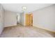 Bedroom with neutral decor, plush carpeting, and ample closet space at 3421 E Jameson Rd, Raleigh, NC 27604