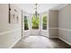 Bright dining nook with bay windows offering lovely outdoor views and modern flooring at 3421 E Jameson Rd, Raleigh, NC 27604