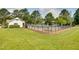 Community swimming pool with fencing and several lounge chairs on the deck, nestled in greenery at 3421 E Jameson Rd, Raleigh, NC 27604