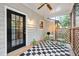 Charming outdoor porch area with stylish flooring and a cozy seating arrangement at 3421 E Jameson Rd, Raleigh, NC 27604