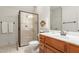 Bathroom with updated shower, glass door, neutral tile, and modern fixtures at 3530 Thorndike Dr, Wake Forest, NC 27587