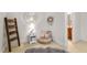 Cozy bedroom nook with decorative ladder and round mirror for a stylish touch at 3530 Thorndike Dr, Wake Forest, NC 27587