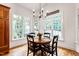 Dining area features beautiful windows and a chandelier at 3530 Thorndike Dr, Wake Forest, NC 27587