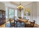 Charming dining room with bay window, hardwood floors, and built-in cabinet at 3530 Thorndike Dr, Wake Forest, NC 27587