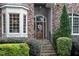 Detailed view of the stone steps leading up to the front door with decorative wreath at 3530 Thorndike Dr, Wake Forest, NC 27587
