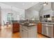 Bright kitchen with granite countertops, stainless steel appliances, and view to dining area at 3530 Thorndike Dr, Wake Forest, NC 27587