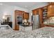 Charming kitchen with granite countertops, stainless steel appliances, and custom wood cabinetry at 3530 Thorndike Dr, Wake Forest, NC 27587