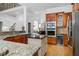 Kitchen boasts stainless appliances, granite counters, island, and bar for entertaining at 3530 Thorndike Dr, Wake Forest, NC 27587