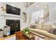 Cozy living room with fireplace, built-in shelving, and comfortable seating at 3530 Thorndike Dr, Wake Forest, NC 27587