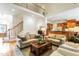 Spacious living room with hardwood floors, staircase, and open-concept design at 3530 Thorndike Dr, Wake Forest, NC 27587