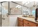 Main bathroom featuring a tile shower, granite countertops, and ample lighting at 3530 Thorndike Dr, Wake Forest, NC 27587