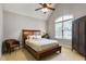 Comfortable primary bedroom with a large window, ceiling fan and tasteful decor at 3530 Thorndike Dr, Wake Forest, NC 27587