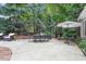 Outdoor patio with seating and dining, perfect for entertaining in a serene and private setting at 3530 Thorndike Dr, Wake Forest, NC 27587