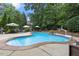 Inviting backyard pool with a basketball hoop and plenty of space for lounging at 3530 Thorndike Dr, Wake Forest, NC 27587