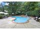 Backyard features a beautiful pool, spacious patio, and lush landscaping for a relaxing outdoor experience at 3530 Thorndike Dr, Wake Forest, NC 27587