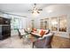 Sunroom with wicker furniture, bright windows, and natural light at 3530 Thorndike Dr, Wake Forest, NC 27587