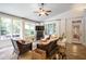 Bright sunroom featuring wicker furniture, tile floor, and a view of the outdoors at 3530 Thorndike Dr, Wake Forest, NC 27587