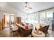 Bright sunroom with tile flooring, wicker furniture and large windows offering ample natural light at 3530 Thorndike Dr, Wake Forest, NC 27587