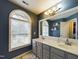 Updated bathroom boasts a large window, double sink vanity, and modern fixtures at 3705 Andoversford Ct, Wake Forest, NC 27587