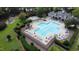 Beautiful community pool with seating, landscaping, playground, and clubhouse, ideal for relaxation at 3705 Andoversford Ct, Wake Forest, NC 27587