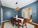 Dining room showcases modern light fixture, seating for six, and hardwood floors at 3705 Andoversford Ct, Wake Forest, NC 27587
