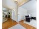 Welcoming entrance area with wooden floors, white door, and a glimpse into the adjacent living spaces at 3705 Andoversford Ct, Wake Forest, NC 27587