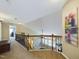 Loft area with wood railing overlooking the living room and neutral walls at 3705 Andoversford Ct, Wake Forest, NC 27587