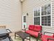 Cozy patio space with comfortable seating, a coffee table, and a grill, ideal for outdoor gatherings at 3705 Andoversford Ct, Wake Forest, NC 27587