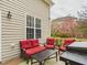 Relaxing patio area with comfortable seating, a coffee table, and an outdoor grill, perfect for enjoying the outdoors at 3705 Andoversford Ct, Wake Forest, NC 27587