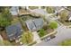Aerial view of a two-story home with a lush backyard, driveway, and neighborhood surroundings at 3725 Song Sparrow Dr, Wake Forest, NC 27587
