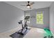 This bedroom is equipped with a stationary exercise bike and has lots of natural light at 3725 Song Sparrow Dr, Wake Forest, NC 27587