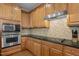 Well-equipped kitchen with modern stainless steel appliances, granite countertops, and ample cabinet space for storage at 3725 Song Sparrow Dr, Wake Forest, NC 27587