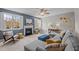 Cozy living room with a fireplace, large windows, and comfortable seating, creating a relaxing atmosphere at 3725 Song Sparrow Dr, Wake Forest, NC 27587