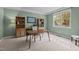Bright home office featuring a large window, built-in shelving, and a neutral color scheme, perfect for productivity at 3725 Song Sparrow Dr, Wake Forest, NC 27587