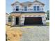 New construction home featuring a covered entrance and an attached two-car garage at 384 Hopewell Branch Ct, Smithfield, NC 27577