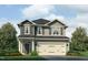 Charming two-story home with a two-car garage, attractive landscaping, and classic architectural details at 384 Hopewell Branch Ct, Smithfield, NC 27577