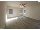 Spacious living room with wood-look floors, recessed lighting, and large windows at 384 Hopewell Branch Ct, Smithfield, NC 27577