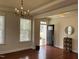 Bright entryway featuring hardwood floors, a modern chandelier, and natural light at 3908 Bostwyck Dr, Fuquay Varina, NC 27526