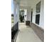 Inviting front porch with brick accents and classic columns at 3908 Bostwyck Dr, Fuquay Varina, NC 27526