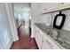 Kitchen with granite countertops, white cabinets, and tile backsplash at 3908 Bostwyck Dr, Fuquay Varina, NC 27526