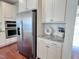 Modern kitchen with stainless steel appliances, white cabinets, and granite countertops at 3908 Bostwyck Dr, Fuquay Varina, NC 27526