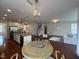 Open-concept living room and kitchen with stainless appliances and hardwood floors at 3908 Bostwyck Dr, Fuquay Varina, NC 27526