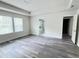 Spacious main bedroom with LVP flooring, ample natural light, and a tray ceiling at 3908 Bostwyck Dr, Fuquay Varina, NC 27526