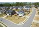 Aerial view of the property on a corner lot with landscaping at 401 Club Center Dr, Youngsville, NC 27596