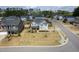 Aerial view of the home showcasing landscaping and neighborhood at 401 Club Center Dr, Youngsville, NC 27596