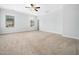 Large bedroom featuring neutral carpet, paint, ceiling fan, and two windows at 401 Club Center Dr, Youngsville, NC 27596