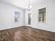 Bright dining area with wood floors, modern lighting, and backyard access at 401 Club Center Dr, Youngsville, NC 27596
